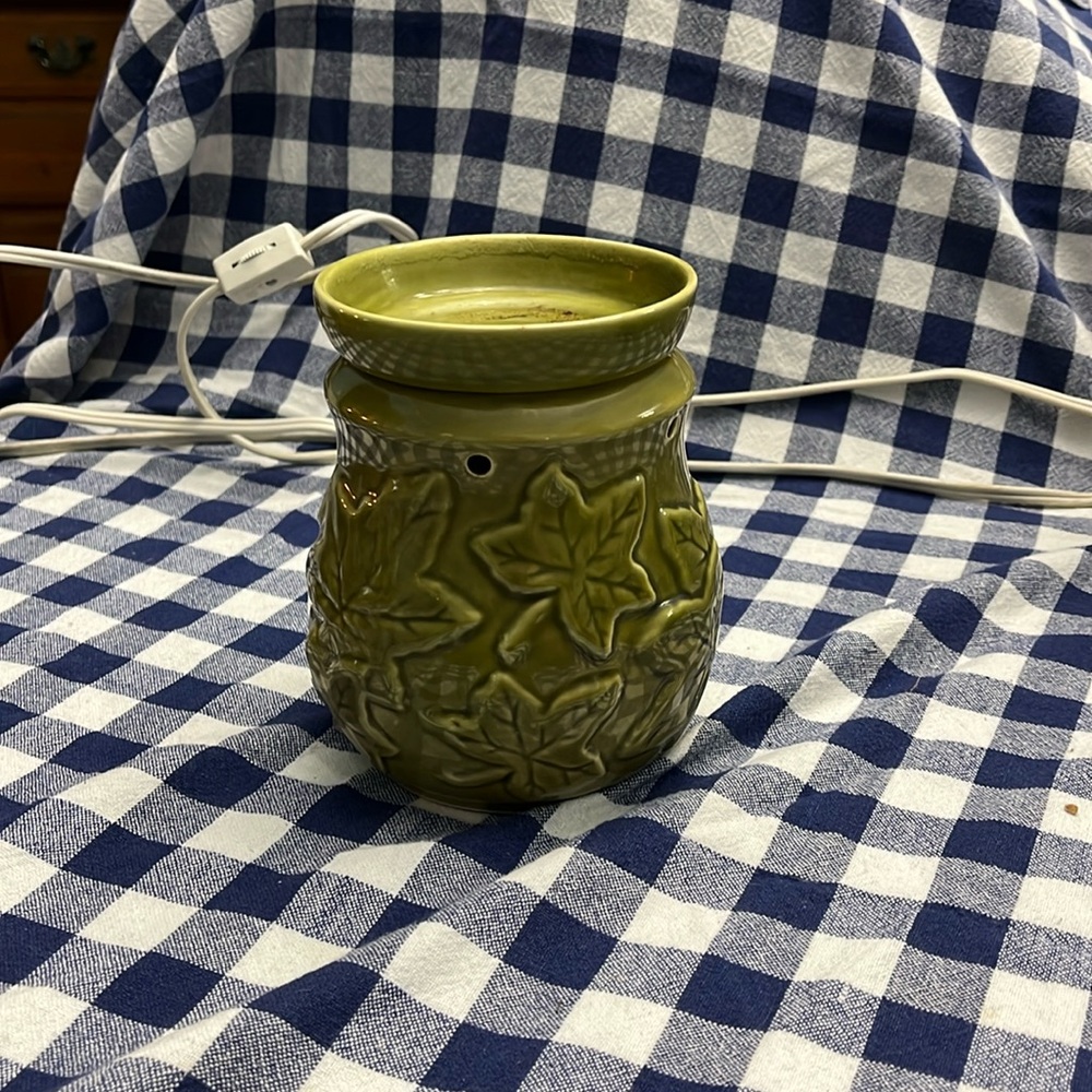 Gently used olive green fall themed maple leaves ceramic electric wax melt.